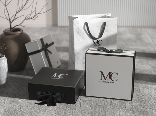 3-black-and-white-gift-boxes-and-white-luxury-gift-bag-on-the ground
