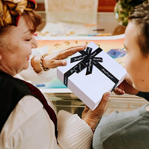 received-a-gift-scene-wrapped-in-a-45x37x18cm-white-gift-box-with-black-crossing-ribbon