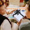 received-a-gift-scene-wrapped-in-a-28x28x10.5cm-white-gift-box-with-black-crossing-ribbon